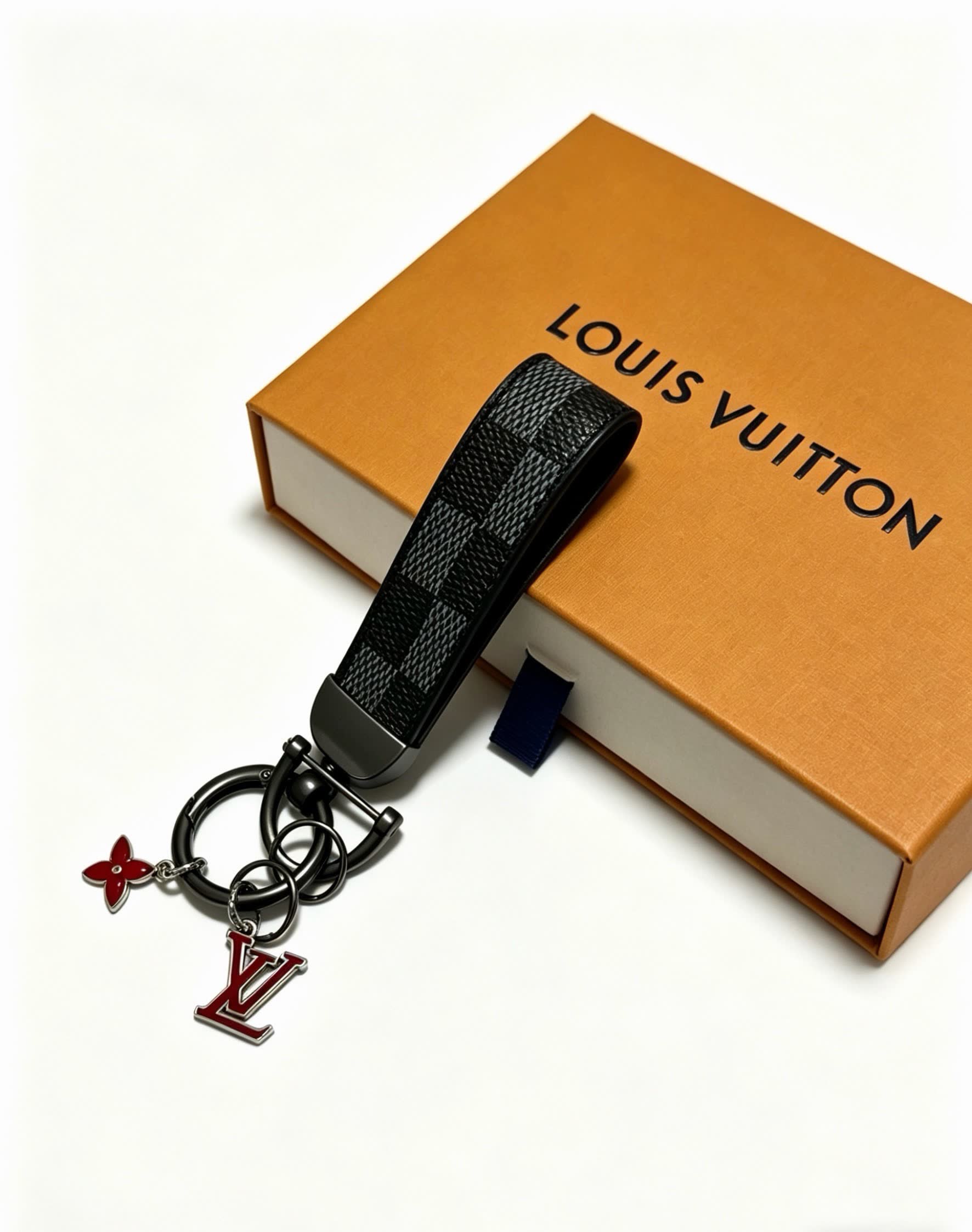 Louis Vuitton Keychain with Monogram Pattern and Logo Charm